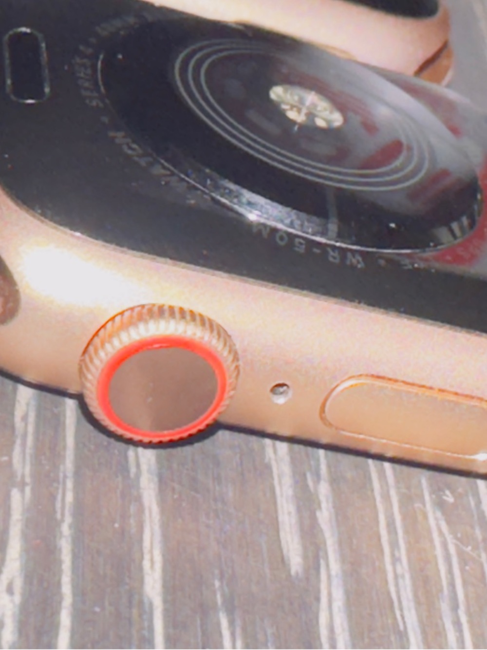 2 Rose Gold Apple Smartwatch’s  with Orange Accent Digital Crown on the 4nike